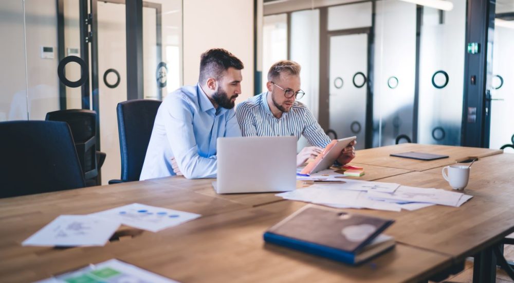 two_office_men_working_together